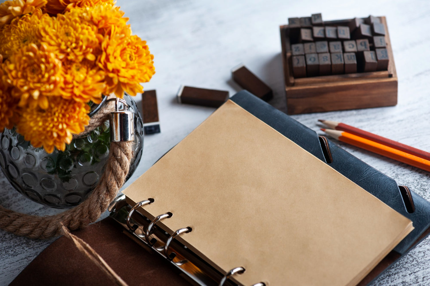 A hand holding an elegant classic notebook with a vintage pen, symbolizing the resurgence of traditional writing methods.