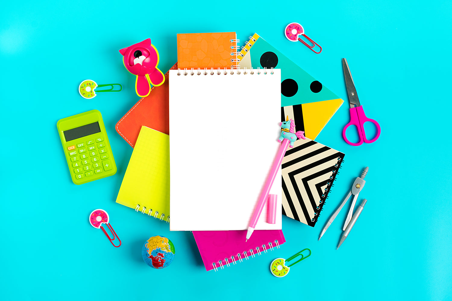 Blue background, office supplies for back to school.